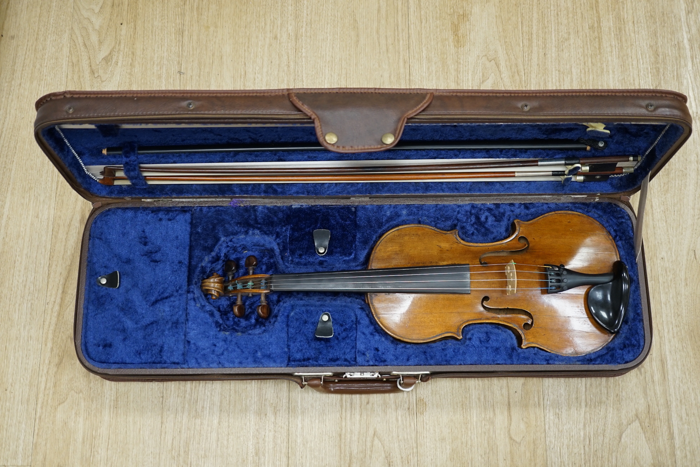 A cased 1830s violin by Didier Nicolas L'aine, branded inside the body, body length 36cm, with two bows, one bow stamped Louis Bazin CITES Submission references 7WRVMZ9B and F37GW7ZR